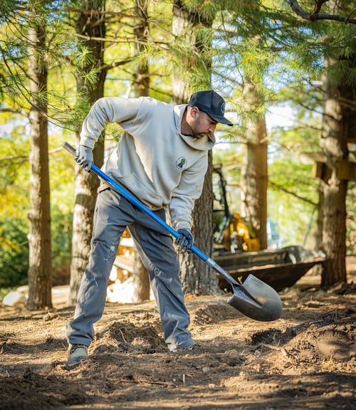 Private Paradise worker shoveling Private Paradise worker shoveling